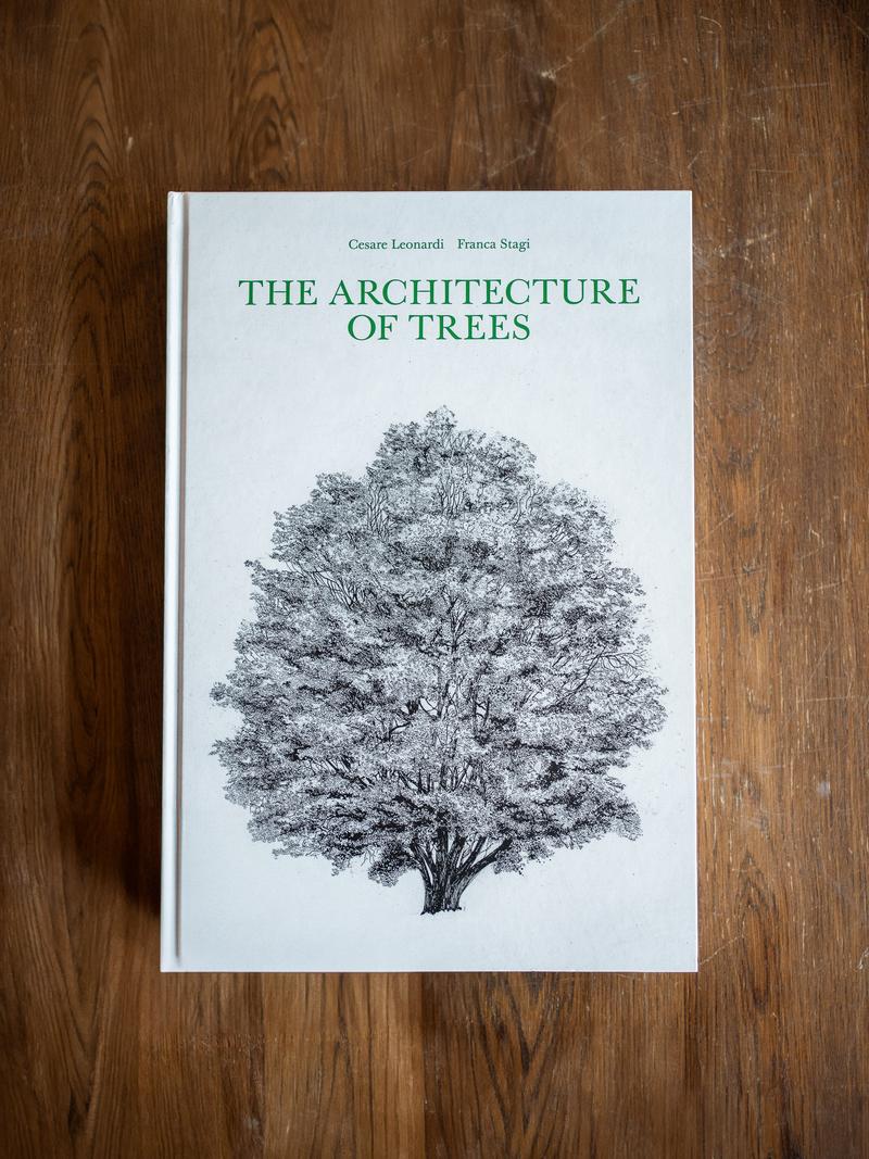 The Architecture of Trees by Cesare Leonardi and Franca Stagi on a wooden desk